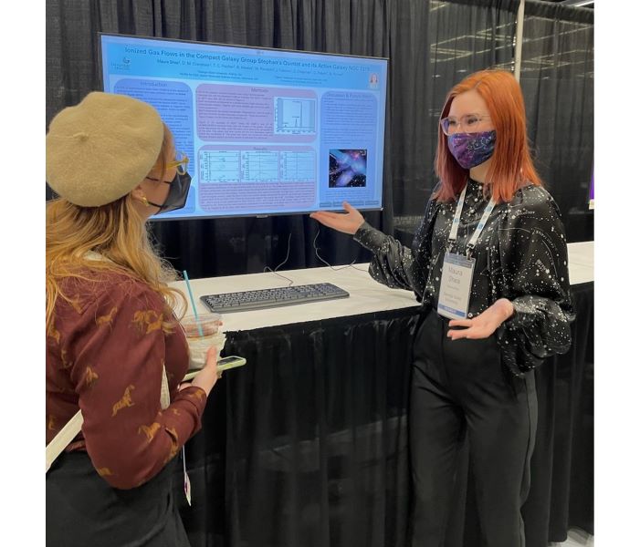 Presenting my poster at AAS.