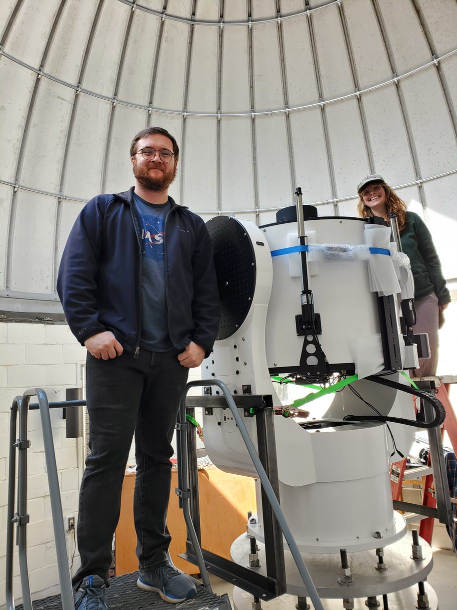 Caleb Abbott and Ellie Lincoln during telescope installation